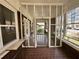 Enclosed porch with brick floor featuring lots of natural light at 472 Parkway Ne Dr, Atlanta, GA 30308