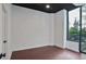 Minimalist bedroom with hardwood floors, modern ceiling fan, and large windows offering natural light at 855 Peachtree Ne St # 1108, Atlanta, GA 30308