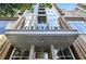 Exterior shot showcasing building's entrance, modern architecture, and surrounding street view at 855 Peachtree Ne St # 1108, Atlanta, GA 30308