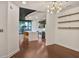 Open floor plan dining area with hardwood floors and a view of the kitchen and entryway at 855 Peachtree Ne St # 1108, Atlanta, GA 30308