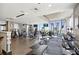 Well-equipped gym boasts modern exercise machines, weights, and scenic windows with city views at 855 Peachtree Ne St # 1108, Atlanta, GA 30308