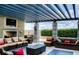 Inviting outdoor lounge area with comfortable seating, a fireplace, and city views at 855 Peachtree Ne St # 1108, Atlanta, GA 30308