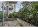 Serene patio with privacy provided by lush greenery, and featuring a view of surrounding architecture at 855 Peachtree Ne St # 1108, Atlanta, GA 30308