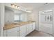 Bright bathroom featuring double vanity with granite counters and access to a bedroom at 11857 Rizvan Pl, Covington, GA 30014