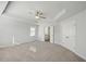 Large bedroom boasts ceiling fan, access to ensuite bathroom, and neutral tones, promising comfort and convenience at 11857 Rizvan Pl, Covington, GA 30014