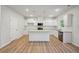 Charming kitchen with white cabinets, granite countertops, and stainless steel appliances at 11857 Rizvan Pl, Covington, GA 30014