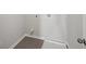 Efficient laundry room featuring tile flooring and modern utility connections, blending functionality and style at 11857 Rizvan Pl, Covington, GA 30014