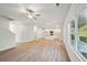 Bright, open living area with kitchen and large windows offering nice views at 11857 Rizvan Pl, Covington, GA 30014