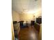 A cozy bedroom with hardwood floors, comfortable bed, and personal touches at 350 Glynnshire Ct, Covington, GA 30016