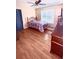 A bright bedroom with hardwood floors, a comfortable bed, and pleasant decor at 350 Glynnshire Ct, Covington, GA 30016