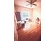 A bedroom featuring hardwood floors, a ceiling fan and natural light at 350 Glynnshire Ct, Covington, GA 30016