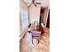 Dining room with hardwood floors, window with blinds, and a dining set at 350 Glynnshire Ct, Covington, GA 30016