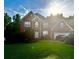 Charming two-story brick home with manicured lawn and mature trees at 350 Glynnshire Ct, Covington, GA 30016