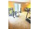 A private home gym with various exercise machines and a walk-out to the exterior at 350 Glynnshire Ct, Covington, GA 30016