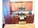 Kitchen with stainless steel appliances and brown cabinets at 350 Glynnshire Ct, Covington, GA 30016