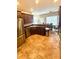 Open kitchen with stainless steel appliances and dining area at 350 Glynnshire Ct, Covington, GA 30016