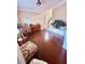 Inviting living room with hardwood floors, a piano, and ample natural light at 350 Glynnshire Ct, Covington, GA 30016