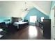 View of the main bedroom featuring an angled ceiling, dark furniture, and a ceiling fan at 350 Glynnshire Ct, Covington, GA 30016