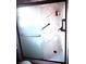 Bathroom shower featuring glass doors, marble style surround, and matte black hardware at 350 Glynnshire Ct, Covington, GA 30016