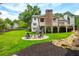 A spacious backyard with stone firepit and ample space for outdoor activities and entertaining at 505 Junction Pt, Roswell, GA 30075