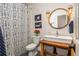 Charming bathroom featuring a modern sink, patterned shower curtain, and navy accents at 505 Junction Pt, Roswell, GA 30075