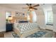 Beautiful bedroom features a ceiling fan, blue accents, and a cozy window seat for relaxing at 505 Junction Pt, Roswell, GA 30075