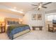 Spacious bedroom featuring a ceiling fan, bench, and cozy decor at 505 Junction Pt, Roswell, GA 30075