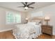 Serene bedroom with hardwood floors, plantation shutters, and neutral decor at 505 Junction Pt, Roswell, GA 30075