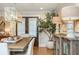 Cozy dining area featuring stylish decor, including lamps and artwork, adjacent to french doors and hardwood floors at 505 Junction Pt, Roswell, GA 30075