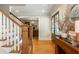 Inviting foyer with hardwood floors and easy access to the home office and other living spaces at 505 Junction Pt, Roswell, GA 30075