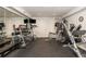 Home gym features weight training machines, free weights, and mirrored wall at 505 Junction Pt, Roswell, GA 30075