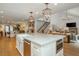 Open kitchen featuring a large island, stainless steel appliances, and easy access to living spaces at 505 Junction Pt, Roswell, GA 30075