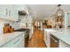 Bright kitchen with white cabinets, stainless appliances, and hardwood floors throughout at 505 Junction Pt, Roswell, GA 30075