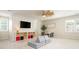 Spacious living room with plush seating, large windows, and built-in shelving at 505 Junction Pt, Roswell, GA 30075