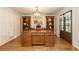 Inviting home office with custom wood bookshelves and double doors leading to the exterior at 505 Junction Pt, Roswell, GA 30075