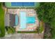 Top-down view of community swimming pool with ample seating and recreational space for residents at 505 Junction Pt, Roswell, GA 30075