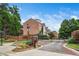 Gated community entrance with well-manicured landscaping and brick signage for a welcoming feel at 7863 Kiverton Pl, Atlanta, GA 30350