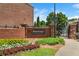 An inviting entrance to a residential community, showcasing beautiful landscaping and gated access at 7863 Kiverton Pl, Atlanta, GA 30350