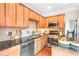 Modern kitchen featuring stainless appliances and granite countertops at 7863 Kiverton Pl, Atlanta, GA 30350