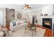 Bright living room with hardwood floors, a fireplace, and neutral decor at 7863 Kiverton Pl, Atlanta, GA 30350