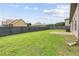 Spacious backyard featuring a well-manicured lawn and a privacy fence at 80 Pulaski Pl, Jonesboro, GA 30238