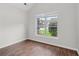 Bright bedroom with a large window, vaulted ceiling, and hardwood flooring at 80 Pulaski Pl, Jonesboro, GA 30238