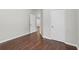 Bedroom with hardwood floors and two doors leading to other parts of the home at 80 Pulaski Pl, Jonesboro, GA 30238