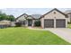 Charming single-Gathering home with a well-manicured lawn and an attached two-car garage at 80 Pulaski Pl, Jonesboro, GA 30238
