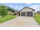 Beautiful home featuring a spacious driveway and attached two-car garage at 80 Pulaski Pl, Jonesboro, GA 30238