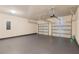 Garage with gray-painted floor and automatic doors at 80 Pulaski Pl, Jonesboro, GA 30238