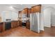 Modern kitchen featuring stainless steel appliances, dark wood cabinets, and hardwood floors at 80 Pulaski Pl, Jonesboro, GA 30238