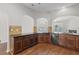 Stylish kitchen with dark countertops, tiled backsplash, and hardwood floors at 80 Pulaski Pl, Jonesboro, GA 30238