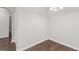 Bright, empty room with wood floors and neutral walls at 80 Pulaski Pl, Jonesboro, GA 30238