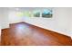 Finished basement with multiple windows offering bright natural light and hardwood-style flooring at 144 Morning Creek Rd, Jonesboro, GA 30238